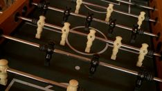 a close up of a foosball table top