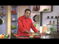 a man standing in front of pots and pans cooking food on a stove top