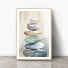 a painting with rocks stacked on top of each other in front of a white wall