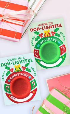 three christmas greeting cards, one with a green cup and the other with a red bowl