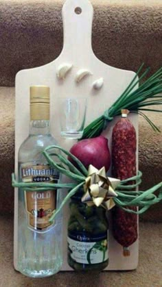 an assortment of food and drinks is displayed on a white cutting board next to some stairs