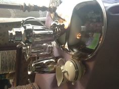 a table topped with silver dishes and cups