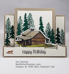 a happy birthday card with an image of a cabin in the woods and trees on it