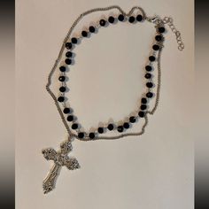 Beautiful Statement Piece, Gothic Cross Pendant On A Double Layered Black Beaded Choker Necklace. *Beaded Chain Length: 35cm + 5cm Extension Chain. *Silver Tone Chain Length: 40cm+5cm Extension Chain. *Cross Size: 5.5cm X 3.7cm *Material: Zinc Alloy. *Brand New. * Ready To Ship Next Day * If You Are Interested In More Than One Item From My Store Pleased Message Me To Make A Bundle For You With Combined Shipping. #Bigcross #Crystaljewelry #Rosarynecklace #Crossnecklace #Grungenecklace Tags: Gothi Black Metal Beaded Necklace With Silver Beads, Black Beaded Necklace With Silver Beads, Gothic Silver Beaded Necklaces With Black Beads, Black Beaded Cross Necklace, Beaded Cross Necklace, Grunge Necklace, Goth Necklace, Gothic Cross, Handmade Jewelry Necklace