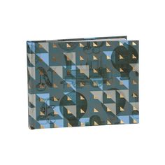 a blue and white book with geometric designs on it