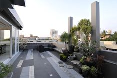 an outdoor patio with potted plants on it