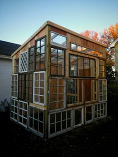 a small house with lots of windows in it