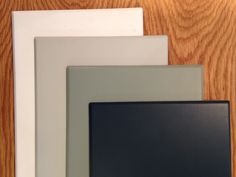 four different types of frames on a wooden surface