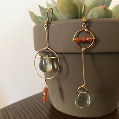 "Asymmetric earrings reminiscent of the blushing pink sunset over sea green. Wear them for a minimalist yet unique look or share as a tasteful gift. 🌷Materials: gold filled wire & glass beads 🌷Size: approx. 3\"x.8\" All Makers Refuge pieces are handmade to order and may have slight variances.  Note that I am a one-person shop and cannot offer exchanges or returns at this time! Thank you for your support 💗" Sunset Blush, Asymmetric Earrings, Blush Earrings, Wired Glass, Sea Sunset, Pink Sunset, Turquoise Glass, Dangling Earrings, Sea Green