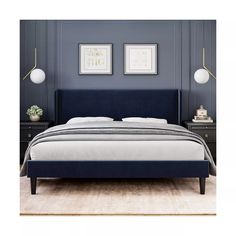 a bed with blue upholstered and white sheets