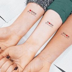 two people with matching tattoos on their arms and feet, one has the word love