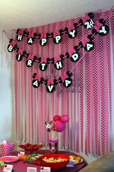 a birthday party with pink and black decorations