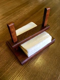 a wooden stand with two napkins on it