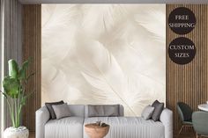 a living room filled with furniture and a wallpapered background that has white feathers on it