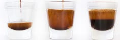 three shot glasses filled with liquid and coffee being poured into one glass to make an espresso