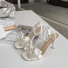 Closed Toe Sandals With Bow For Summer, Beige Bow Sandals For Summer, High Heel Sandals With Bow For Spring, Summer Wedding Sandals With Pointed Toe, Pointed Toe Sandals For Summer Weddings, White Closed Toe Sandals With Bow, Beige Bow Heels For Summer, Spring Beige Bow Heels, Beige Heels With Bow For Summer