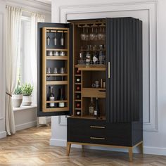 an armoire in the shape of a cabinet with wine glasses and liquor bottles inside