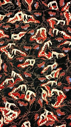 an image of a black and red background with many different colored animals on it's face