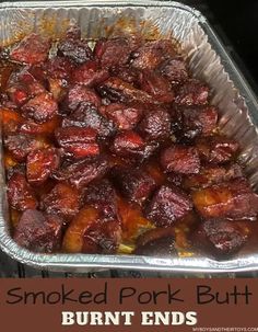 smoked pork butts in foil pan with text overlay that reads smoked pork butts burnt ends