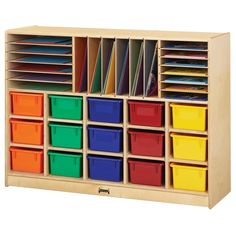 a wooden storage unit with many different colored bins