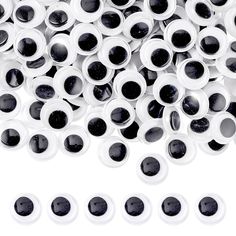 a pile of black and white plastic eyeballs