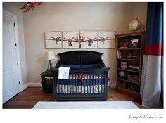 a baby's room with a crib, bookshelf and rugs