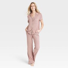 You're sure to look forward to going to bed when you have the Beautifully Soft Short-Sleeve Notch-Collar Top and Pants Pajama Set from Stars Above™ in your sleepwear wardrobe. Thanks to our Beautifully Soft fabric with a relaxed fit, this two-piece sleepwear set feels weightless against your skin and offers a comfortable night’s sleep. In a solid hue, the pajama set comes with a short-sleeve button-down shirt with a notch collar and chest patch pocket for classic flair, along with a pair of pull Pink Pajama Pants, Best Pajamas, Pajama Pant, Sleepwear Sets, Notch Collar, Collar Top, Soft Shorts, White Tank Top, Pull On Pants