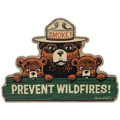 a sticker that says smokey prevent wildfires with three bears on it