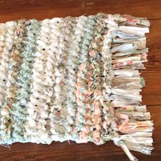 an old rag rug is laying on the floor