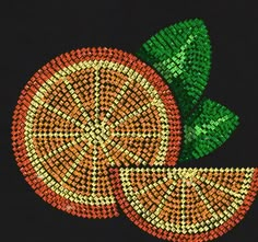 an orange with green leaves on it is made out of sequins and beads