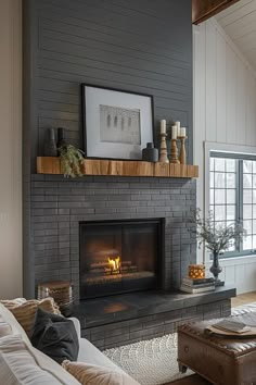 a living room filled with furniture and a fire place in the middle of the room