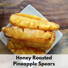 honey roasted pineapple spears on a white plate with the words honey roasted pineapple spears