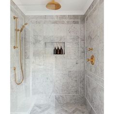 the before and after shots of a bathroom remodel in white marble with gold fixtures