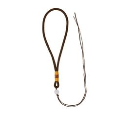 a brown lanyard with an orange and white bead on the end is shown