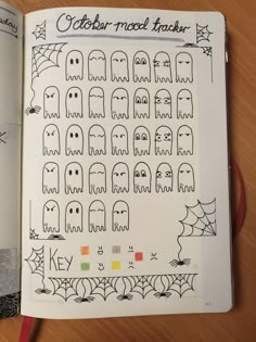 an open notebook with halloween stickers on it