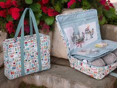 two suitcases sitting next to each other with knitting supplies in them and flowers behind them