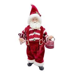 a santa clause doll holding a coffee cup and teapot in one hand while wearing a red suit with white stripes on it