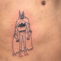 a man's chest with a drawing of batman on the bottom and an outline of his head