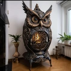 an owl clock sitting on top of a wooden floor