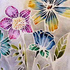 an image of flowers painted on paper with watercolors in the process of being colored