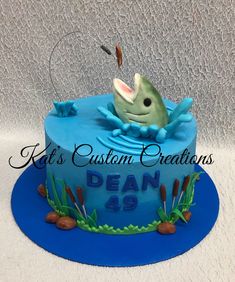 a birthday cake with a fish on top