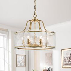 a chandelier hanging over a dining room table