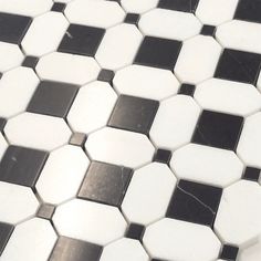 a black and white tiled floor with small squares