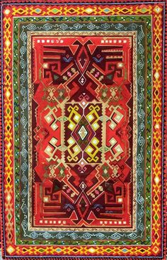 a red and green rug with an intricate design on the center, surrounded by multicolored lines