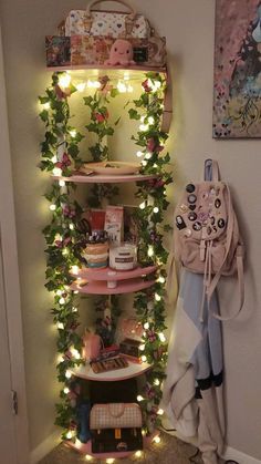 there is a shelf with many items on it in the corner, and lights are strung up all around