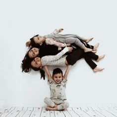 three women and two children laying on the floor