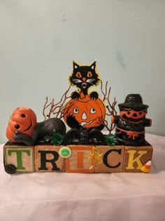 a wooden block that says trick with pumpkins and jack - o'- lanterns