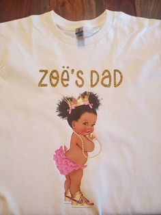 African American baby girl Pink and Gold T-shirt Great for baby shower or birthday party. T-shirt color can be white or pink Lettering can be gold, pink or white. T-shirts are 100% cotton. Processing Time: Please allow 5-7 business days for your order to be processed before shipping. Shipping: Please allow 3-5 business days for your order to be shipped. Cute First Birthday T-shirt With Custom Print, Cute Custom Print T-shirt For First Birthday, Personalized Pink T-shirt For Birthday, Personalized Pink T-shirt For Gender Reveal, Cute Pink Party T-shirt, Pink And Gold Baby Shower, Birthday Party Pink, Baby Shower Shirts, Gold Baby Shower