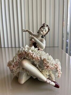 a figurine sitting on top of a table