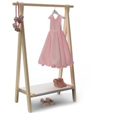 a pink dress and shoes on a clothes rack